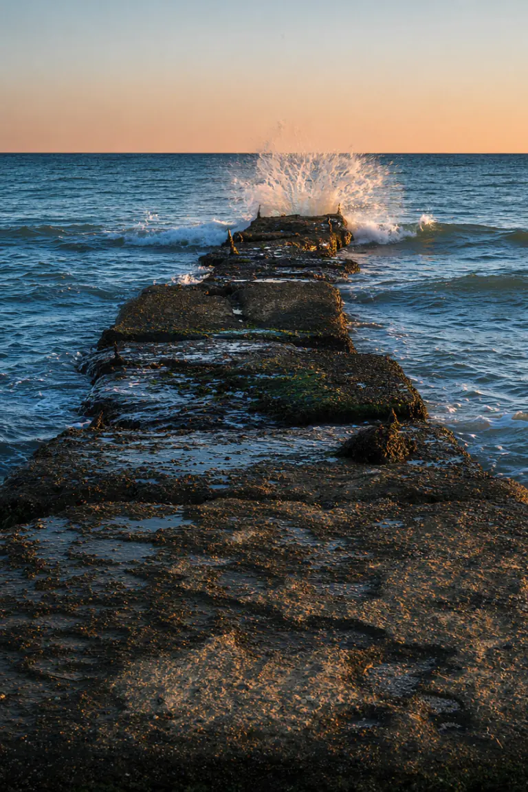 AI visualization of a breakwater reshoot with a wave in low light